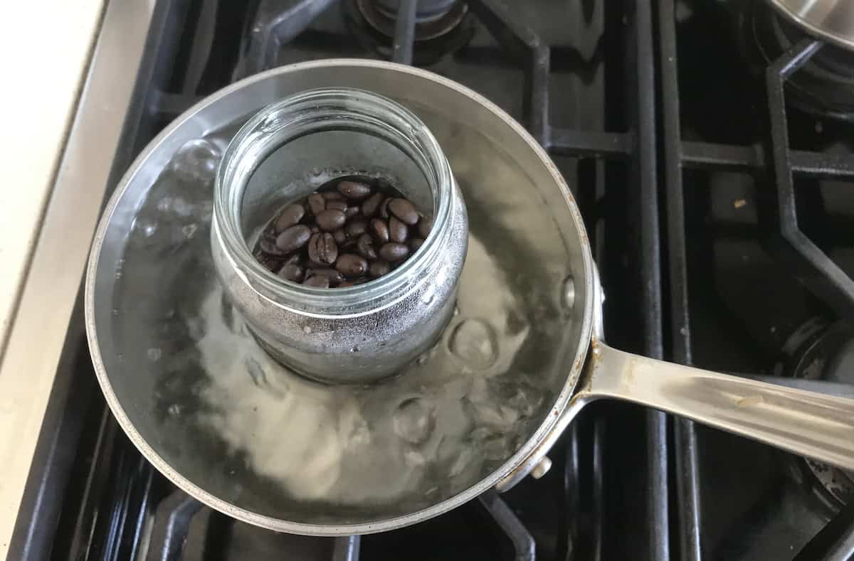 Brewing coffee from whole beans over the stove